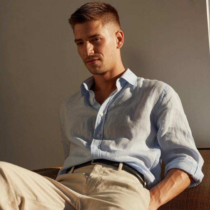 A man with an oval face sporting short haircut