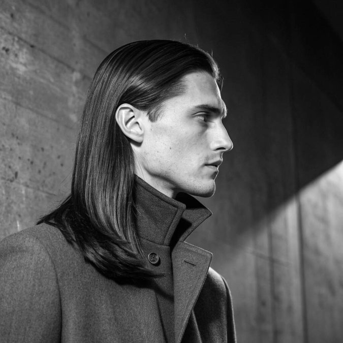Long straight hair with a clean center part and glossy finish