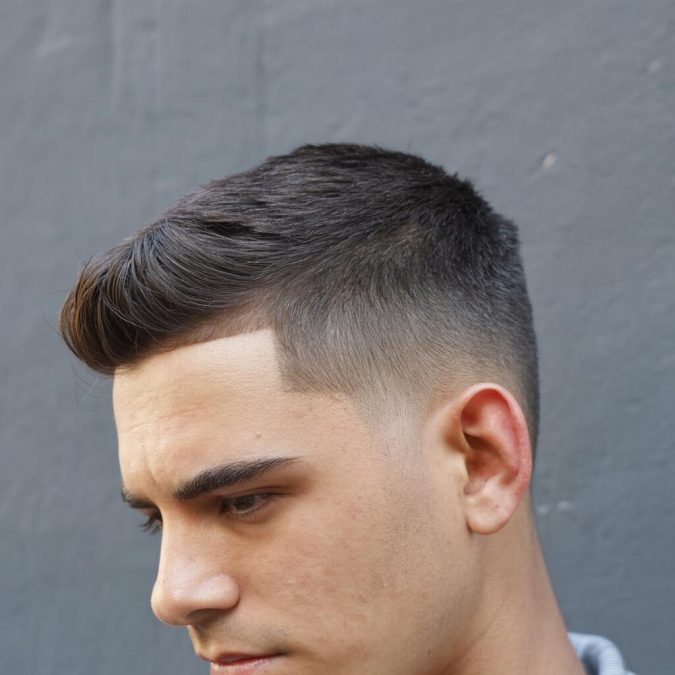 man featuring Low Fade hairstyle