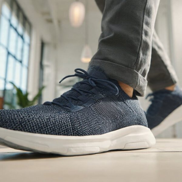 diabetic footwear mens flat lay with knit sneakers, woven leather loafers and suede shoes on neutral background