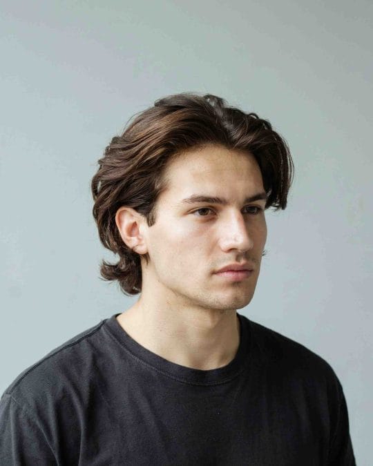 Medium-length wavy hair with layered texture and natural flow.