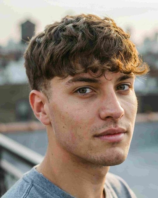 Textured wavy fringe with soft movement across the forehead.