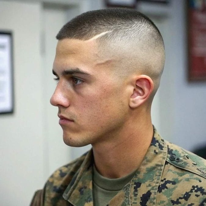 Man with a military crew cut featuring an ultra-short top and close faded sides.