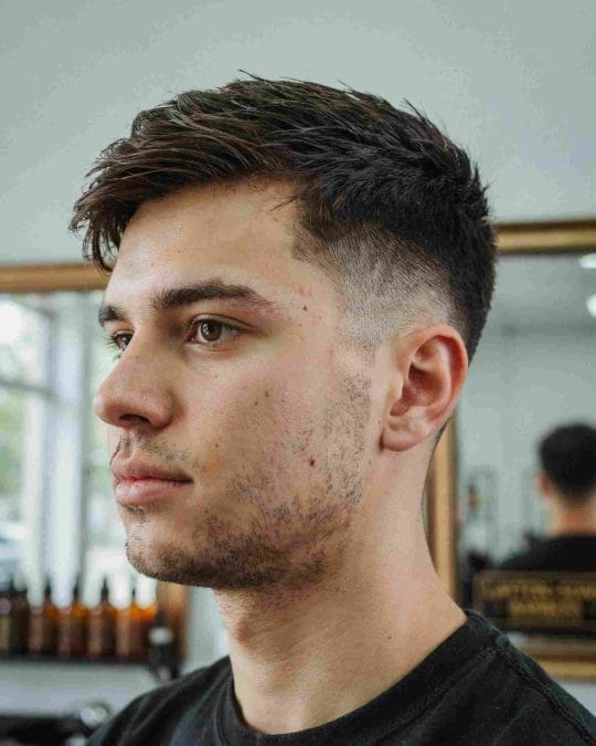Man with a modern crew cut fade and textured top.