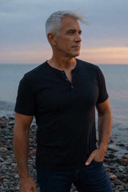 Mature man with a silver crew cut standing outdoors.