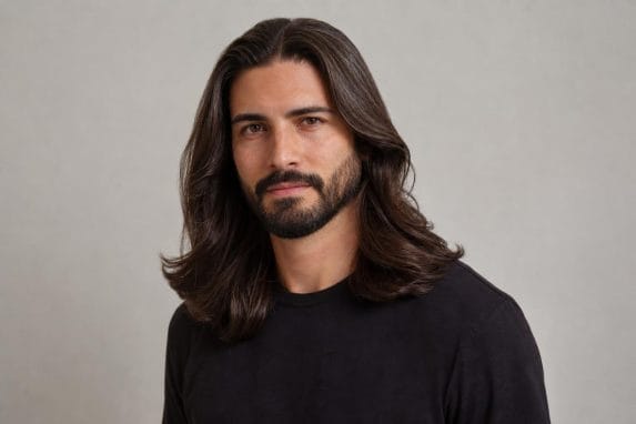 Man with clean, styled long hair demonstrating an intentional everyday look